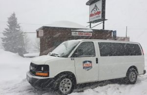 Alta Shuttle in Front of Alta Lodge on a Snowy Day