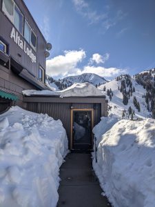 Alta Lodge Entryway with Snow. Mt. Baldy in the background.