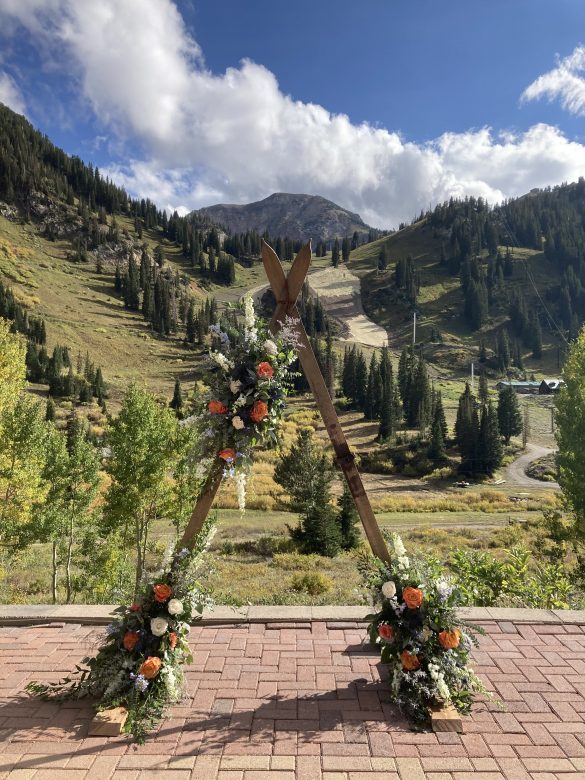wedding arch made from skis, mount baldy and Alta Ski Area in the background